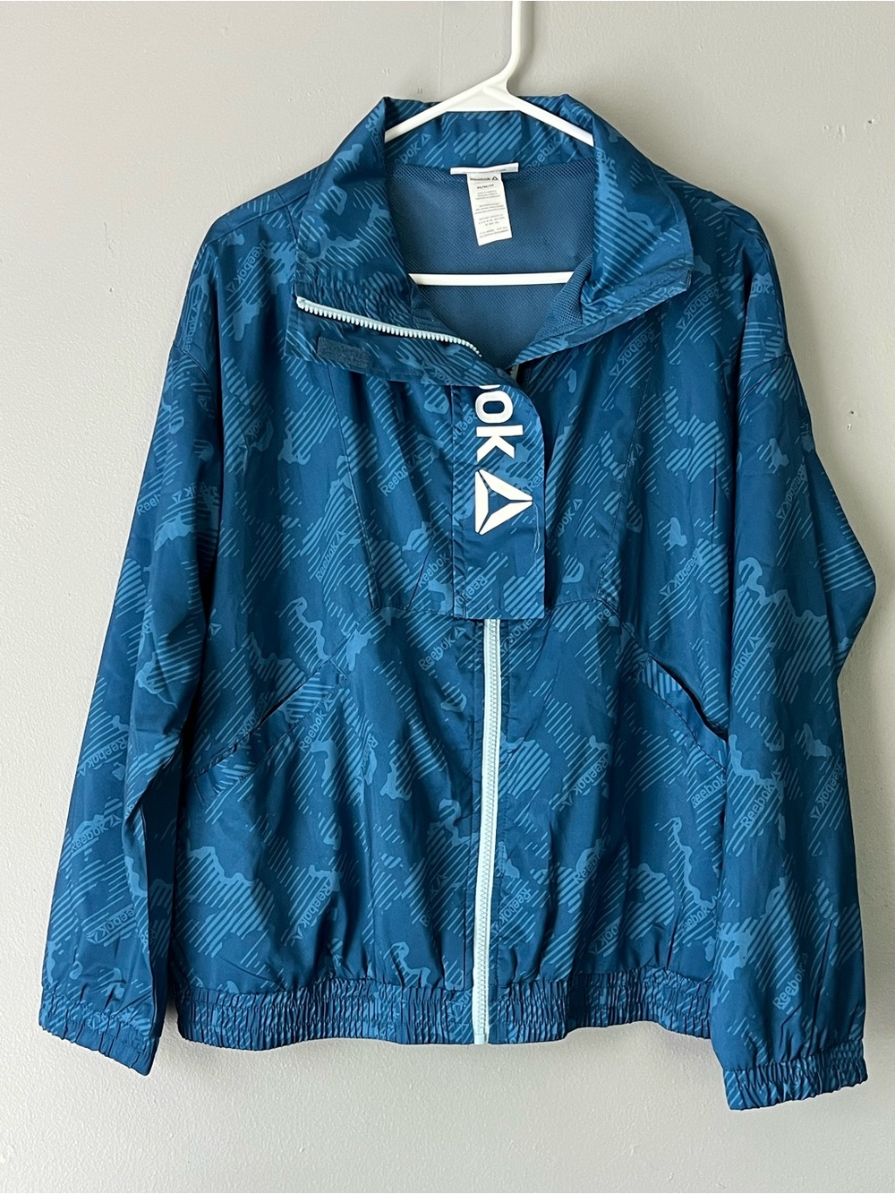 Reebok full zip windbreaker jacket blue pattern mesh lined women’s medium
